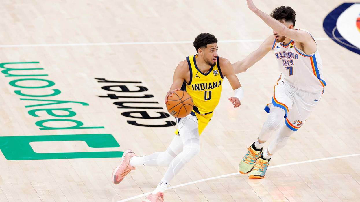 Indiana Pacers guard Tyrese Haliburton (0) drives to the basket past Oklahoma City Thunder forward Chet Holmgren (7) during the fourth quarter in game five of the 2025 NBA Finals at Paycom Center.