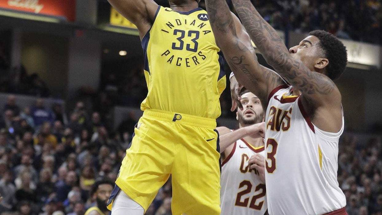 Indiana Pacers Myles Turner goes up to shoot against Cleveland Cavaliers Marquese Chriss during the first half of an NBA basketball game Saturday Feb 9 2019 in Indianapolis.