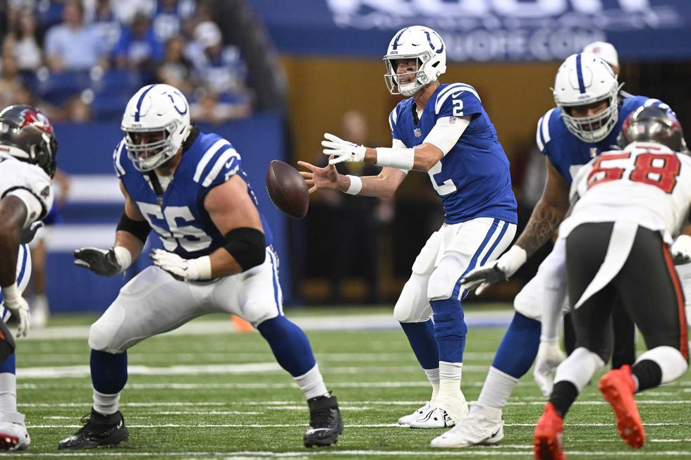 Indianapolis Colts quarterback Matt Ryan (2) takes the snap during the first quarter of the game against the Tampa Bay Buccaneers at Lucas Oil Stadium.