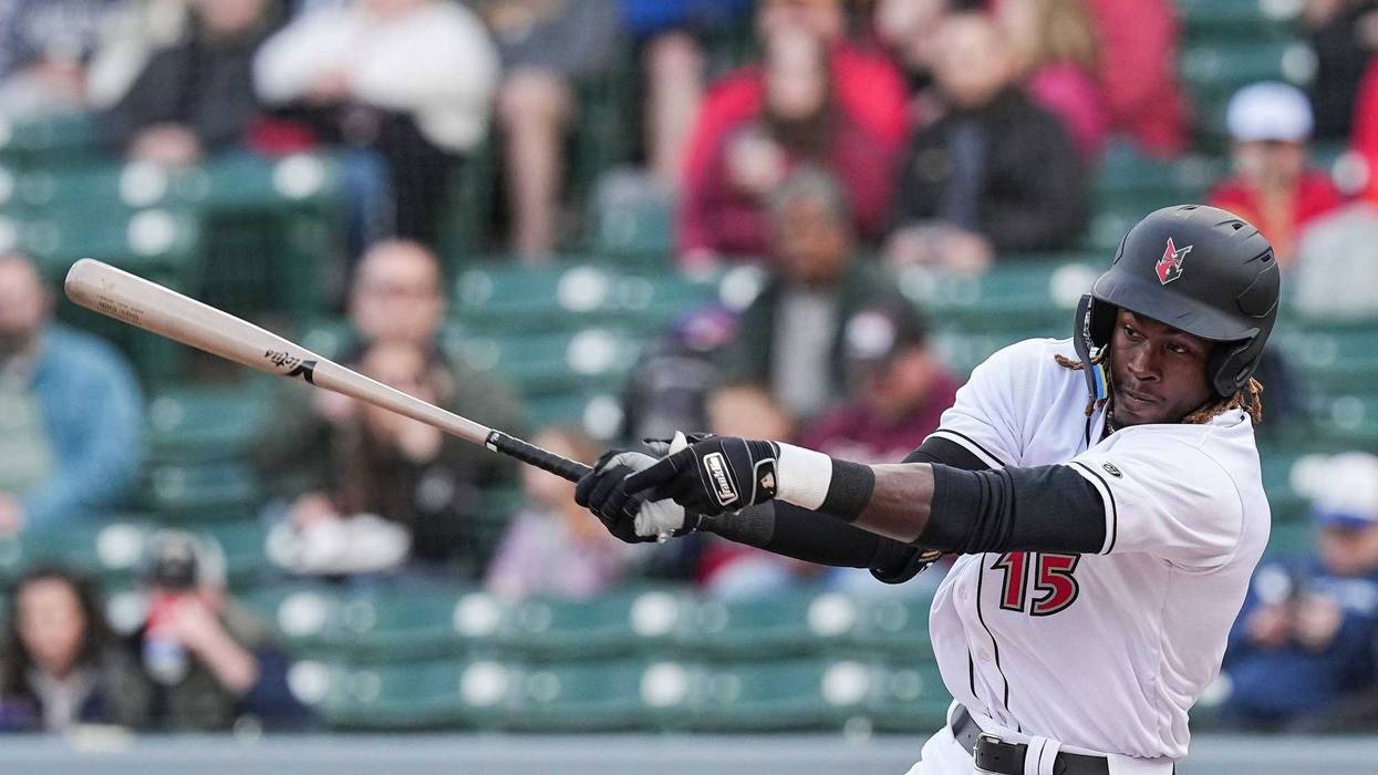 Indianapolis Triple-A short-stop Oneil Cruz (15) swings at the ball during the game agains the Omaha Storm Chasers