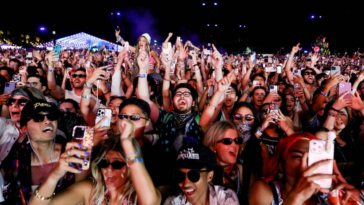 INDIO, CALIFORNIA - APRIL 13: (FOR EDITORIAL USE ONLY) Festivalgoers watch Zedd perform at the Outdoor Theatre during the 2025 Coachella Valley Music and Arts Festival at Empire Polo Club on April 13, 2025 in Indio, California.