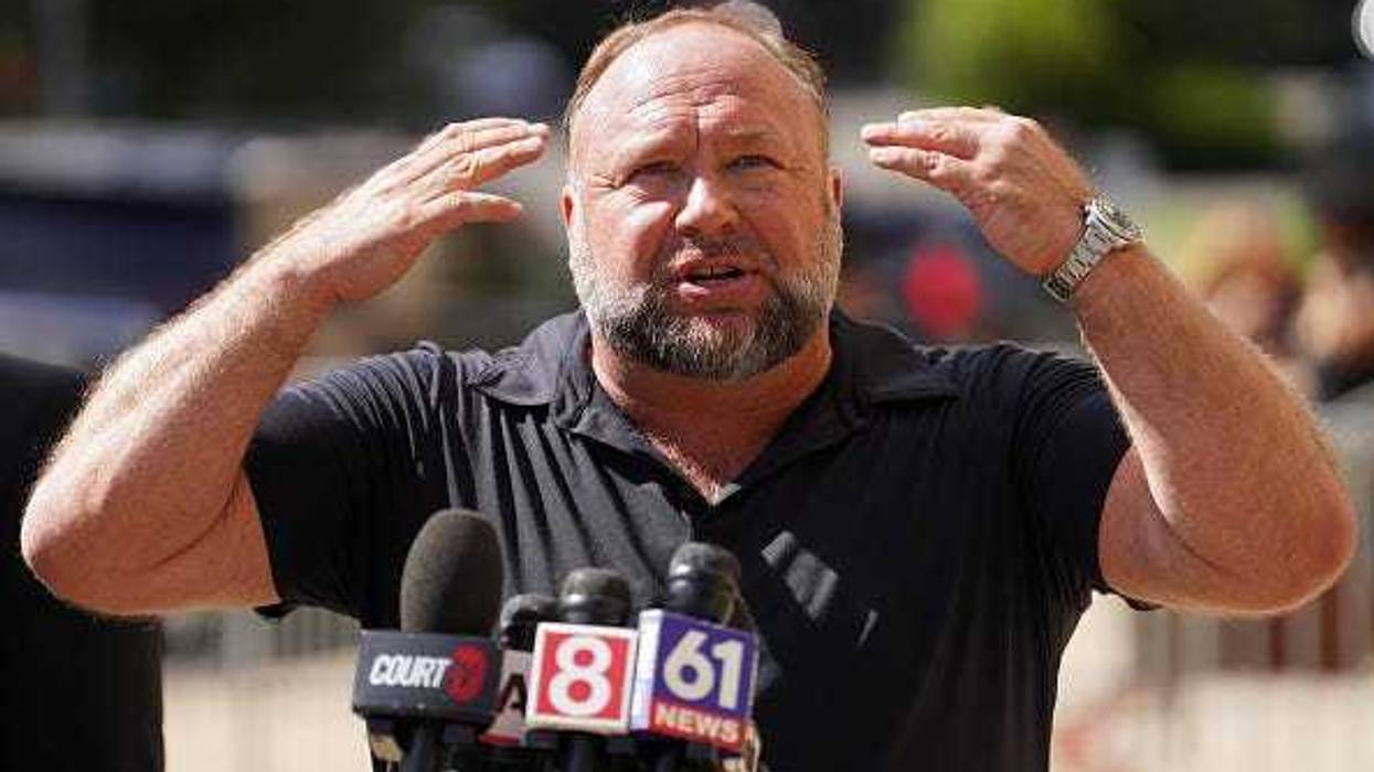 InfoWars founder Alex Jones speaks to the media outside Waterbury Superior Court during his trial on September 21, 2022 in Waterbury, Connecticut.