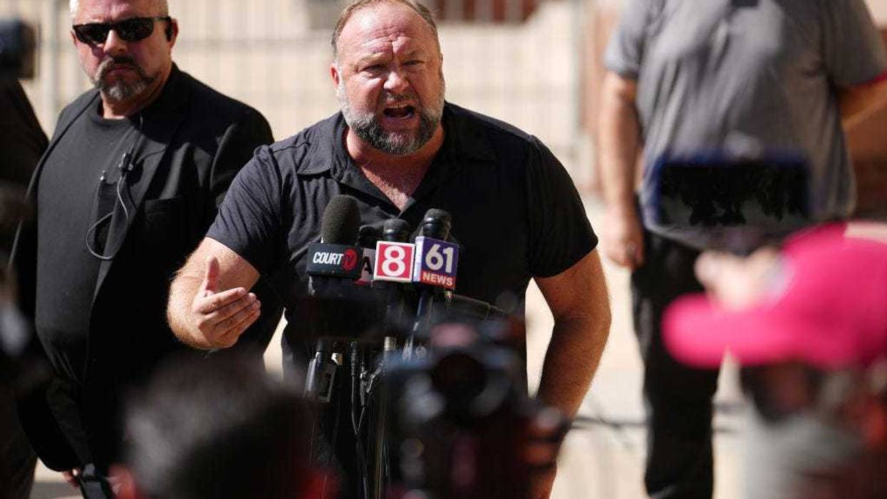 InfoWars founder Alex Jones speaks to the media outside Waterbury Superior Court during his trial on September 21, 2022 in Waterbury, Connecticut. Jones is being sued by several victims' families for causing emotional and psychological harm after they lost their children in the Sandy Hook massacre. A Texas jury last month ordered Jones to pay $49.3 million to the parents of 6-year-old Jesse Lewis, one of 26 students and teachers killed in the shooting in Newtown, Connecticut. (Photo by Joe Buglewicz/Getty Images)