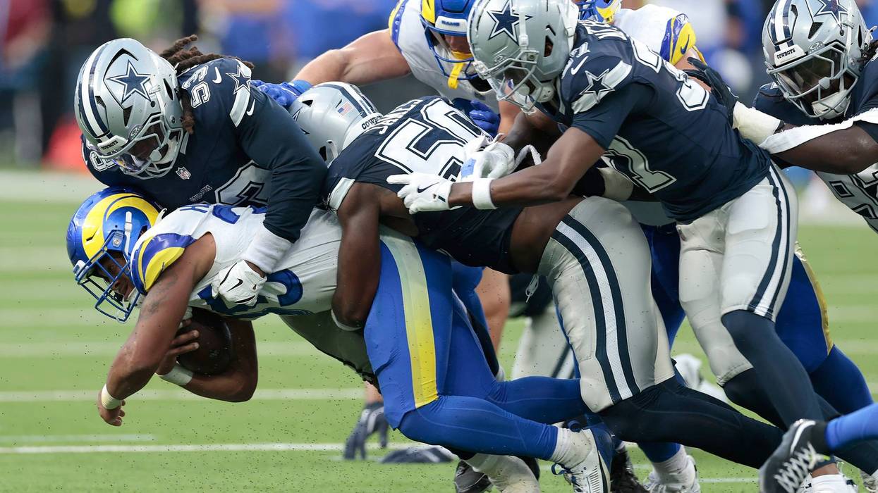 INGLEWOOD, CALIFORNIA - AUGUST 09: Jarquez Hunter #35 of the Los Angeles Rams is tackled by James Houston #53 of the Dallas Cowboys in the second half of a NFL Preseason 2025 at SoFi Stadium on August 09, 2025 in Inglewood, California. (Photo by Ronald Martinez/Getty Images)