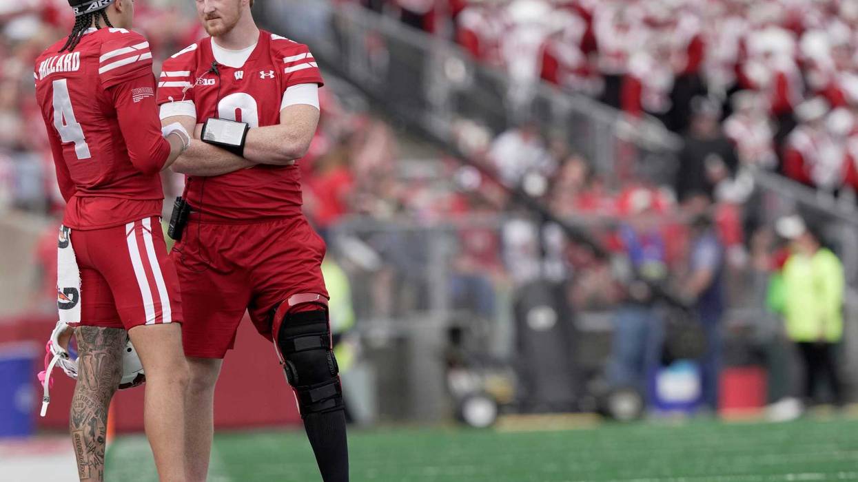 Injured Wisconsin quarterback Billy Edwards Jr. (9) talks with wide receiver Jayden Ballard (4) during the second quarter of their game against Ohio State Saturday, October 18, 2025 at Camp Randall Stadium in Madison, Wisconsin.