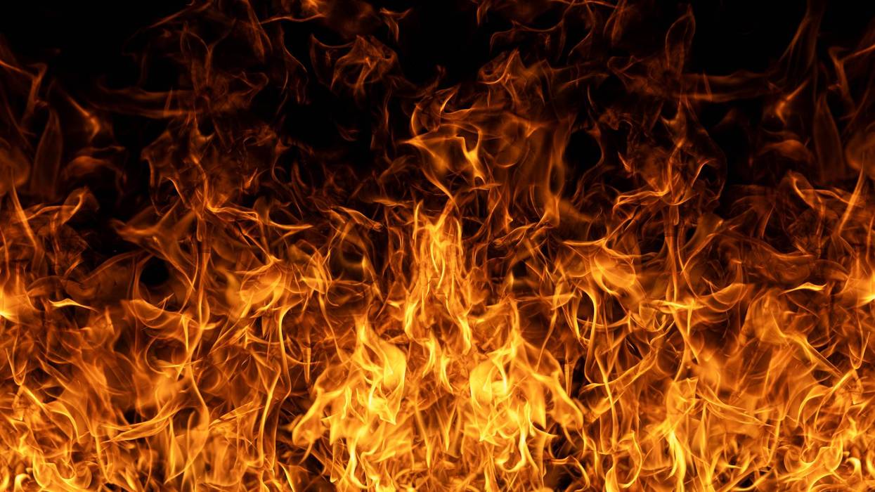 Intense burning fire texture for overlay layer effects. Flame abstract design. Glowing flames on black background. Inferno effect with flame. Flames with dramatic fire background. Burning flame.