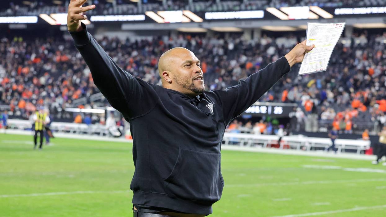 Interim head coach Antonio Pierce of the Las Vegas Raiders gestures to fans as he runs off the field after the team's 27-14 victory over the Denver Broncos at Allegiant Stadium on January 07, 2024