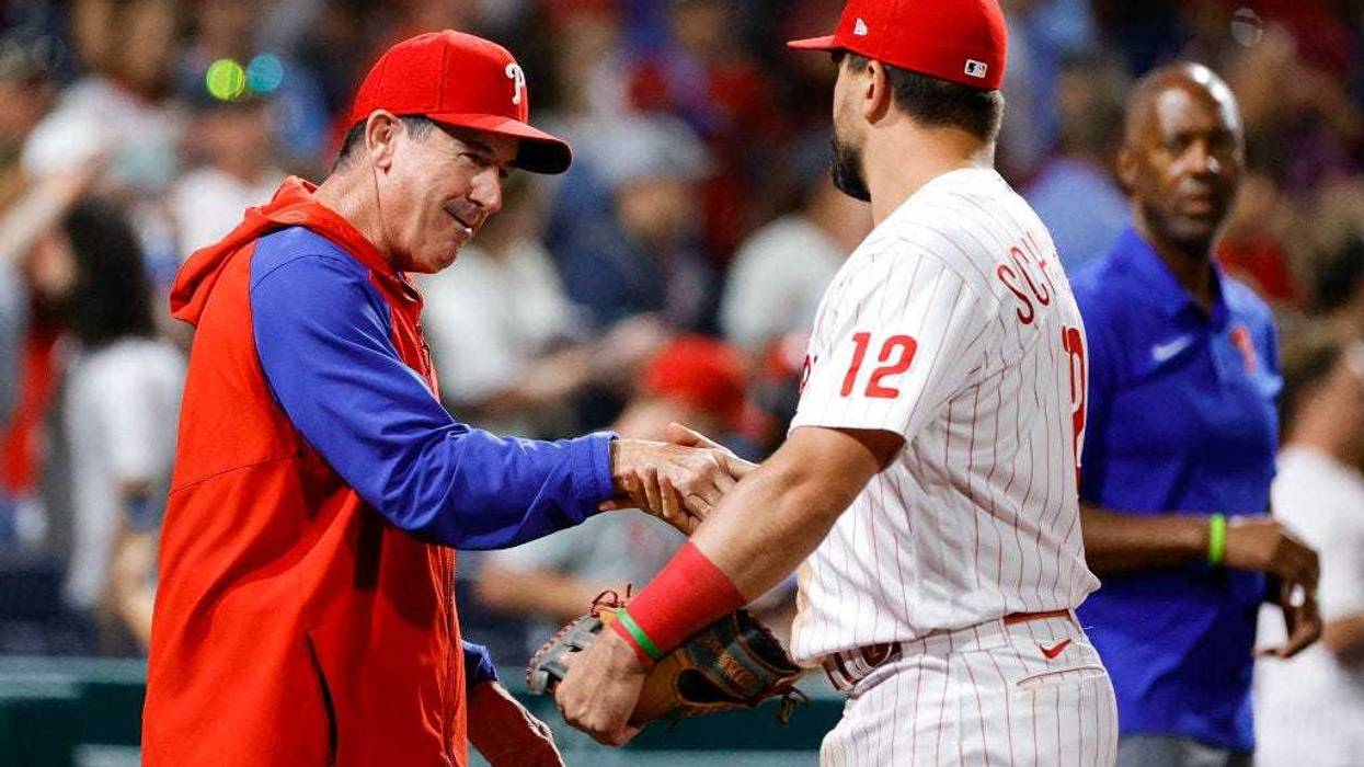 Interim manager Rob Thomson and Kyle Schwarber, #12 of the Philadelphia Phillies, celebrate after defeating the Los Angeles Angels at Citizens Bank Park on June 4, 2022, in Philadelphia, Pennsylvania.