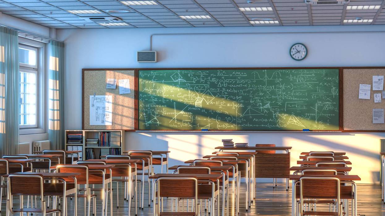 interior of a school classroom with wooden desks and chairs. nobody around. 3d render