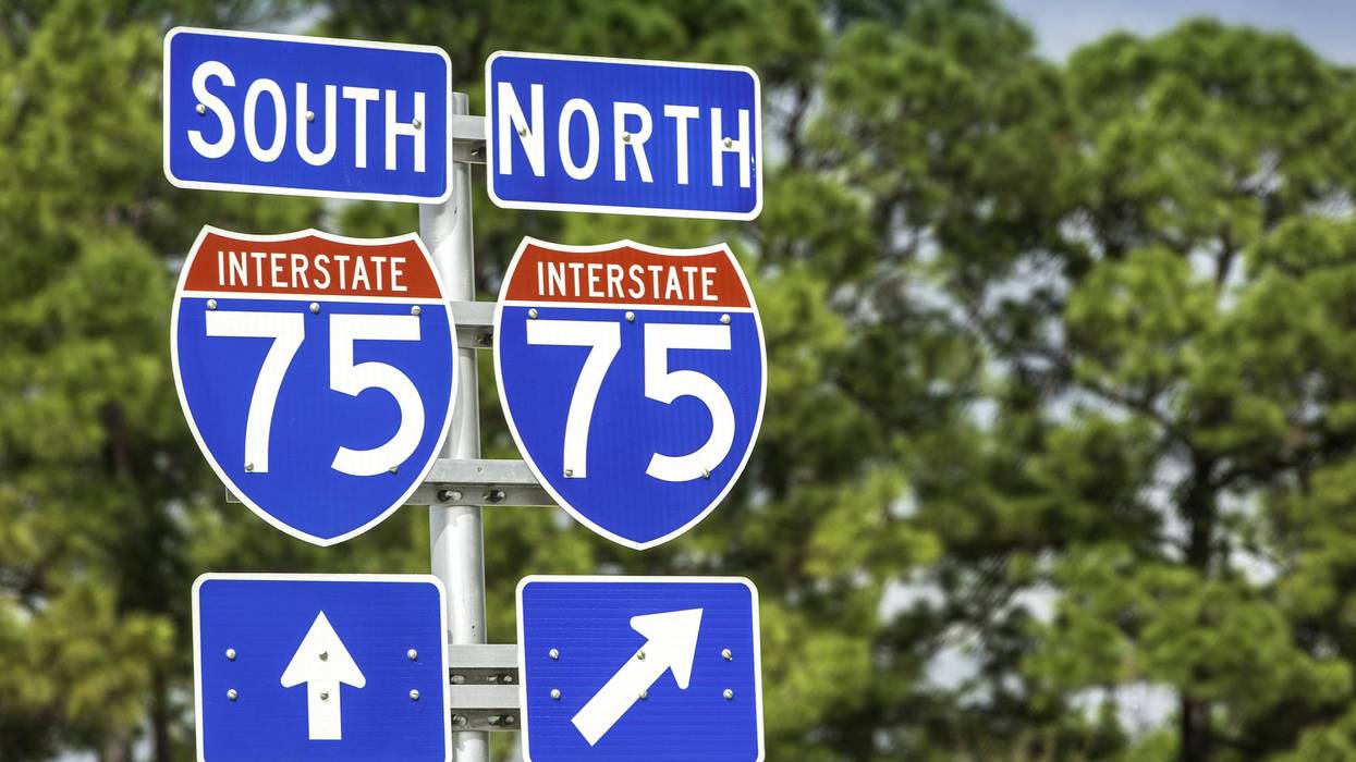 Interstate 75 South and North road signs, with straight and diagonal right arrows.