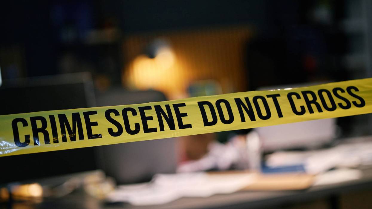 Investigating Police Crime Scene with Warning Tape