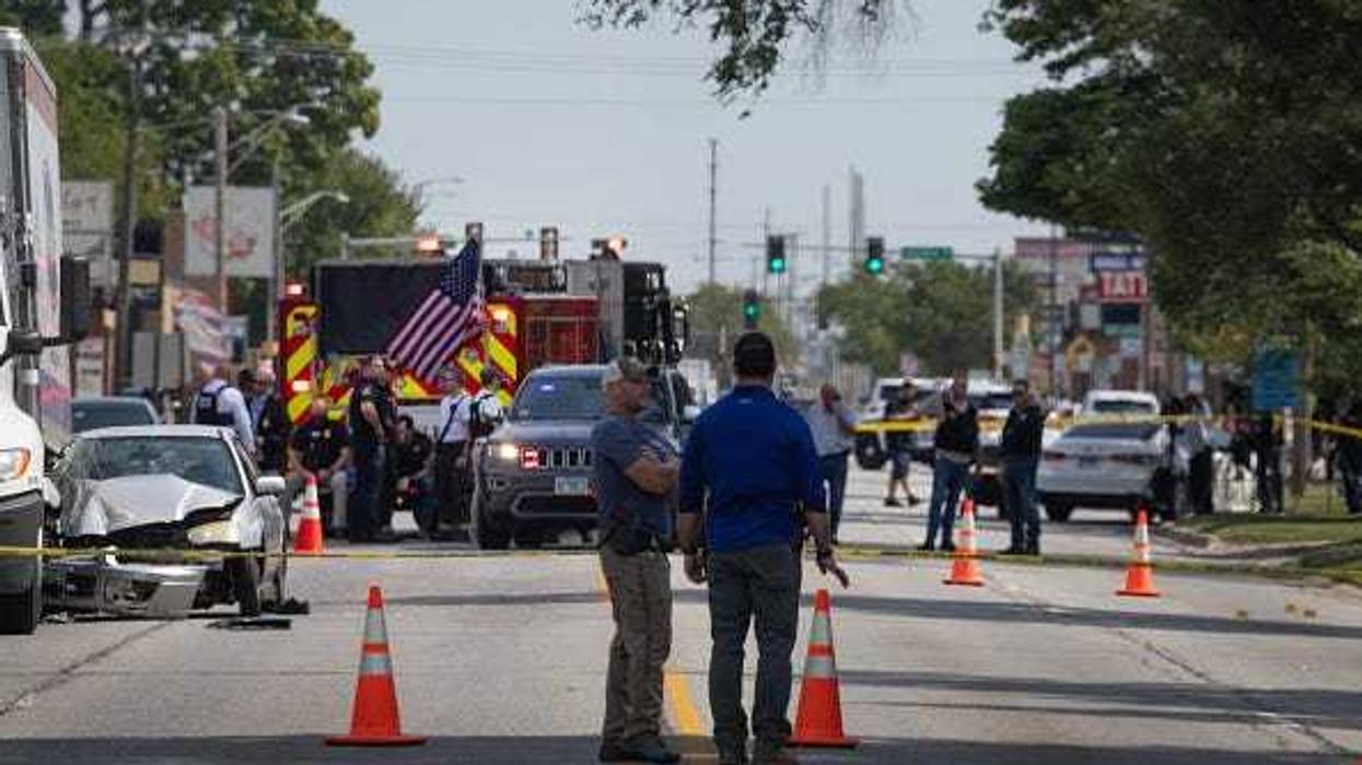 Investigators collect evidence after a man crashed his vehicle after being fatally shot during a confrontation with ICE officers on September 12, 2025 in Franklin Park, Illinois. The Chicago area has seen a surge in ICE activity recently, part of the Trump administration's crackdown on undocumented immigrants in the area dubbed "Operation Midway Blitz". (Photo by Scott Olson/Getty Images)