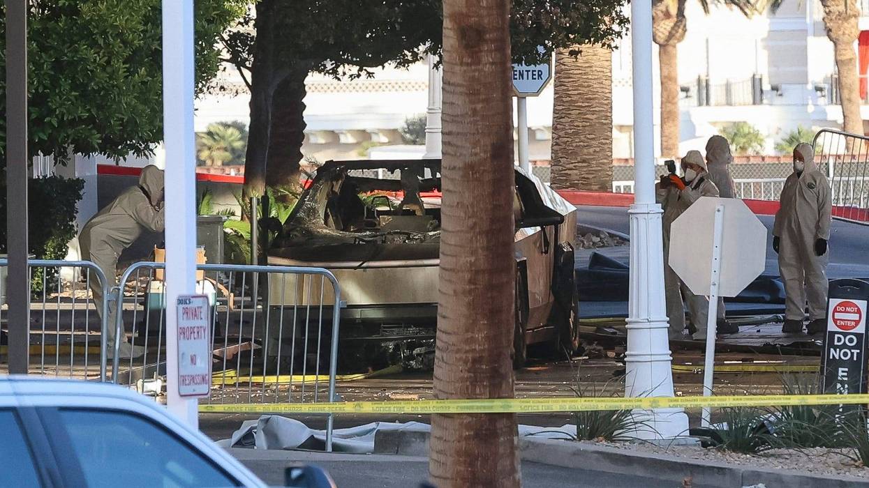 Investigators photograph a Tesla Cybertruck that exploded outside the lobby of President-elect Donald Trump's hotel on Jan. 1 in Las Vegas.