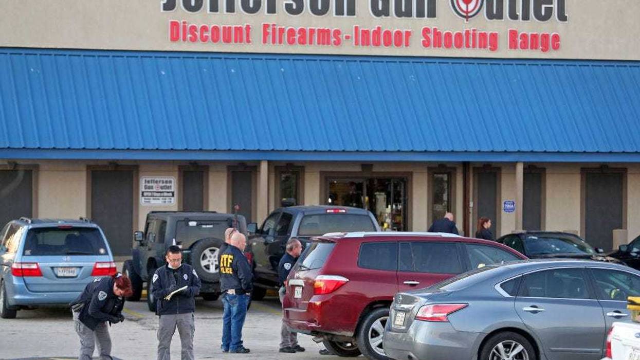 Investigators with the Jefferson Parish Sheriffs Office look at a shell casing in the parking lot of the Jefferson Gun Outlet as investigators work the scene on February 20, 2021 in Metairie, Louisiana. According to reports, three people were killed and two injured after an altercation lead to gunfire at an indoor shooting range. (Photo by Michael DeMocker/Getty Images)