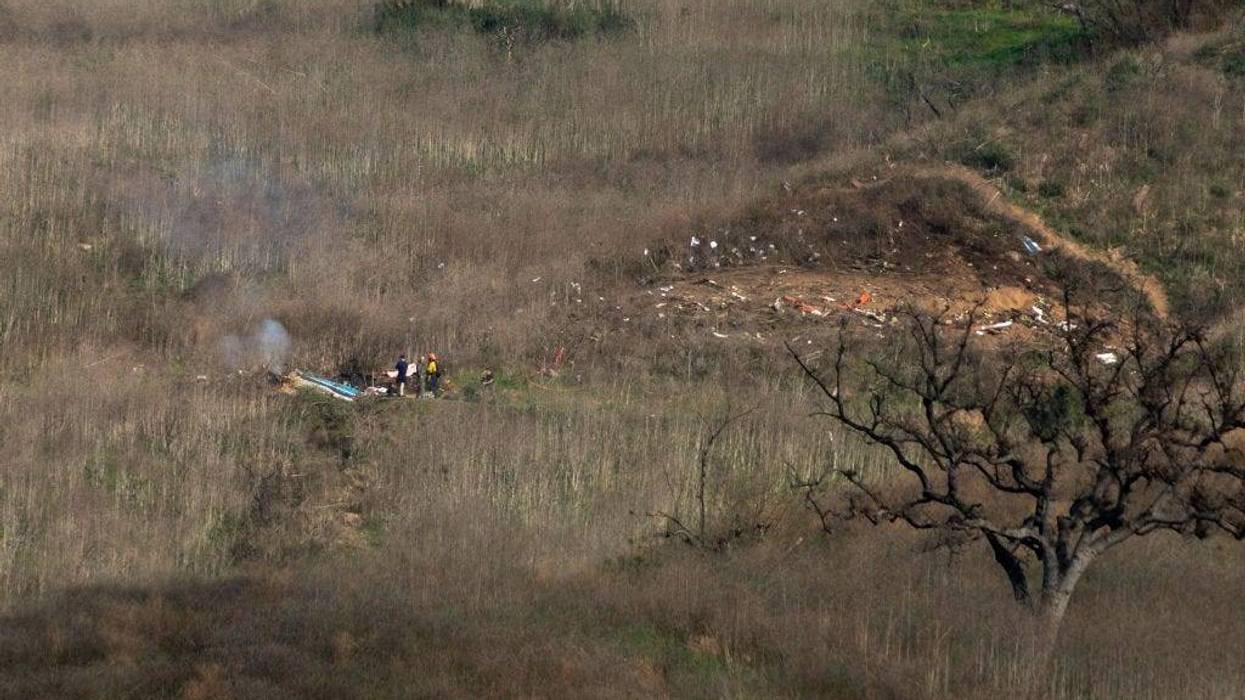 Investigators work at the scene of a helicopter crash that killed former NBA star Kobe Bryant on January 26, 2020 in Calabasas, California.