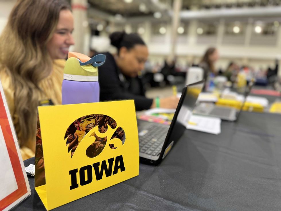 Iowa Hawkeyes sign at table
