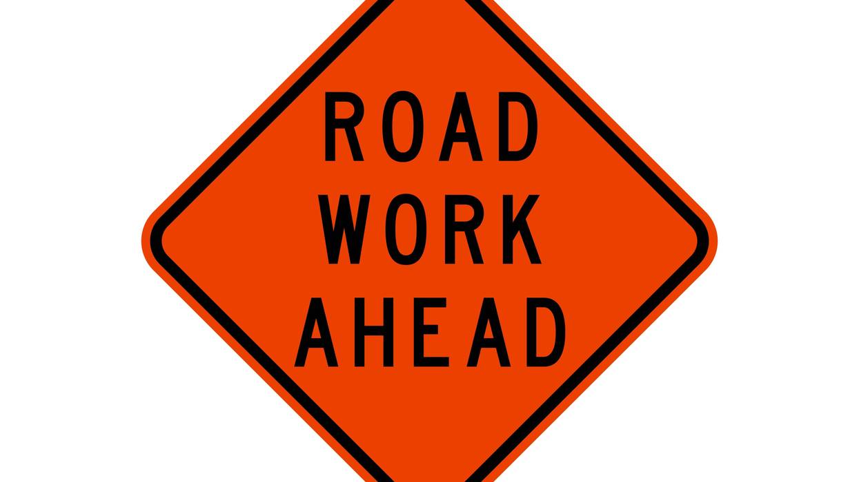 isolated road sign for road work