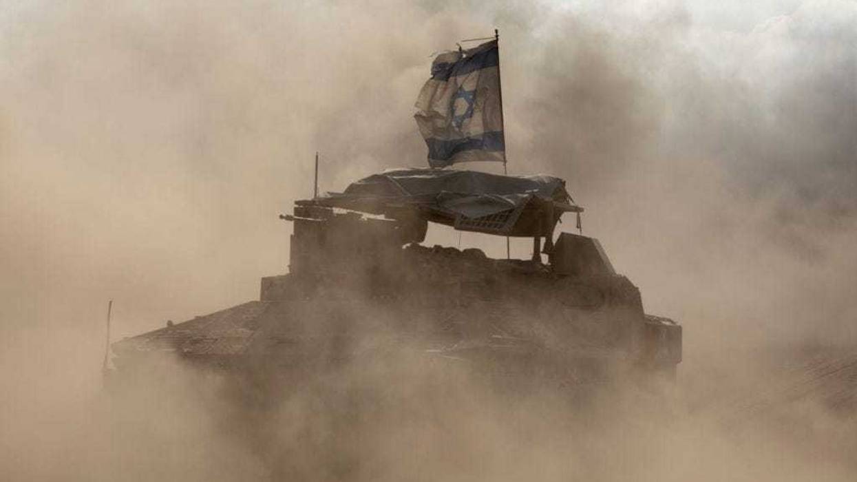 Israeli armored personnel carriers move along the border with the Gaza Strip on May 29, 2024 in Southern Israel, Israel.