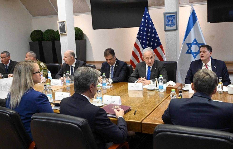 Israeli Prime Minister Benjamin Netanyahu (2nd R, Rear) meets with U.S. Secretary of State Antony Blinken (C, Front) at the HaKirya military base in Tel Aviv, Israel, on Oct. 12, 2023