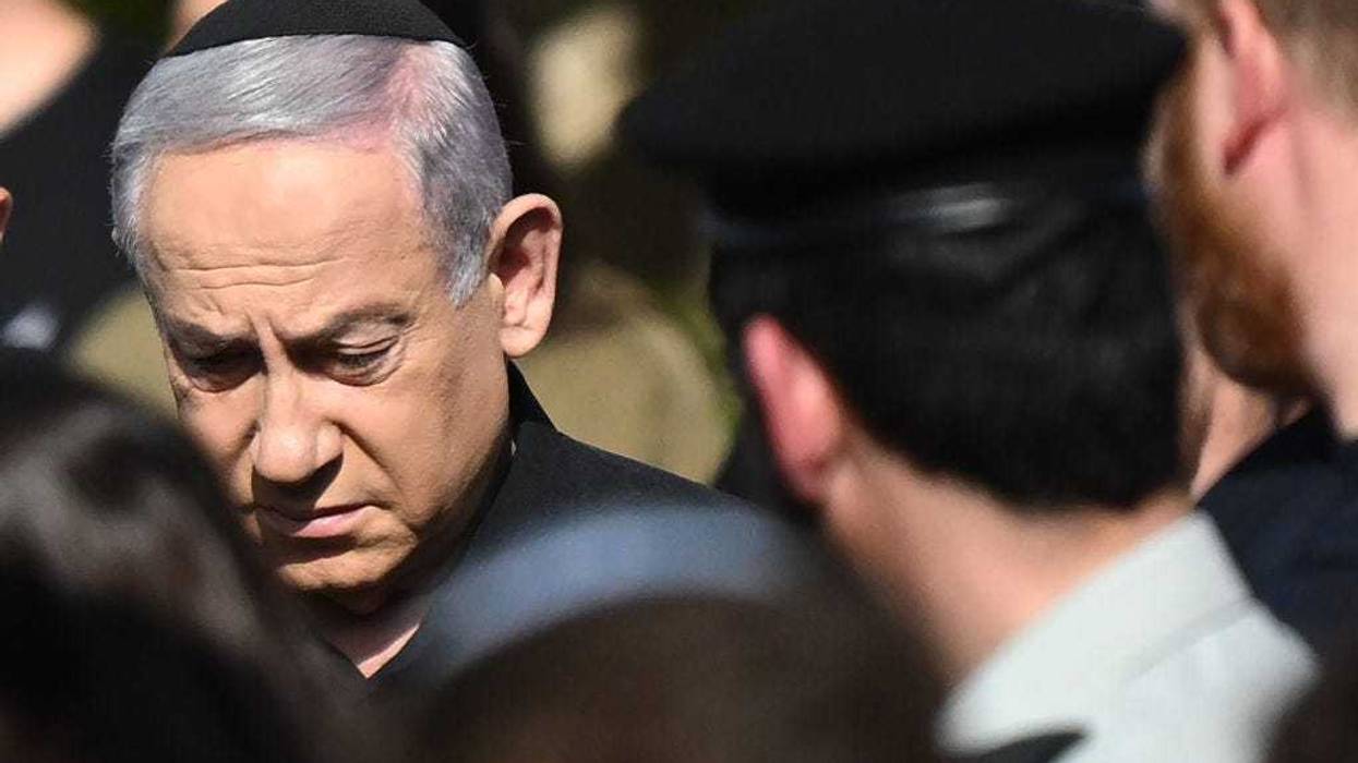 Israeli Prime Minister Benjamin Netanyahu (L) attends the funeral for First Sergeant Major Gal Meir Eisenkot, 25 years old, at the Herzliya cemetery on December 8, 2023 in Herzliya, Israel.