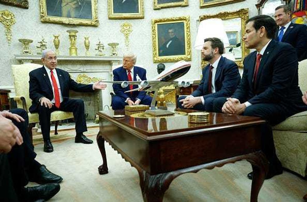 Israeli Prime Minister Benjamin Netanyahu (L) speaks alongside U.S. President Donald Trump, with a model of Air Force One on the table, during a meeting in the Oval Office of the White House on April 7, 2025 in Washington, DC. President Trump is meeting with Netanyahu to discuss ongoing efforts to release Israeli hostages from Gaza and newly imposed U.S. tariffs. Vice President JD Vance and Secretary of State Marco Rubio were also in attendance. (Photo by Kevin Dietsch/Getty Images)