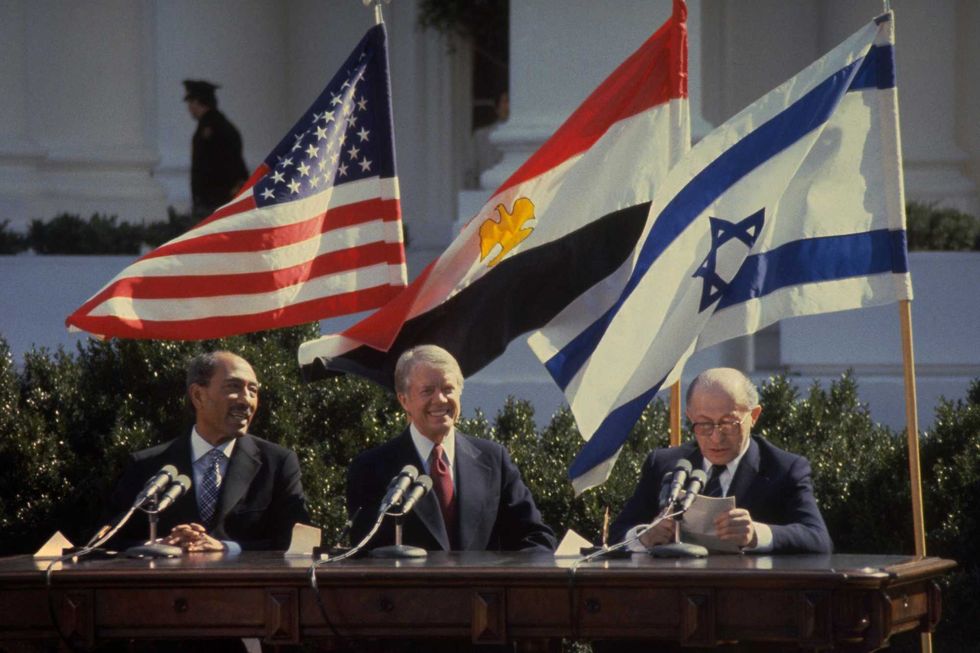 Israeli Prime Minister Menahem Begin (R) addressing the peace treaty signing ceremony as Egyptian President Anwar Sadat (L) and U.S. President Jimmy Carter watch on the White House lawn on March 26, 1979 in Washington, DC. Israel and Egypt will mark 30 years since their then leaders signed the historic agreement, making Egypt the first Arab nation to recognize the Jewish State.