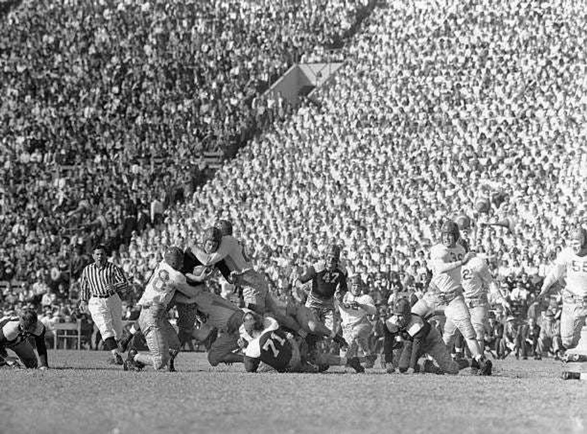 It's a classic college football matchup, USC and Notre Dame. But it's taken over a century to get to a point where college football finally has what every other sport has - a legitimate postseason playoff.