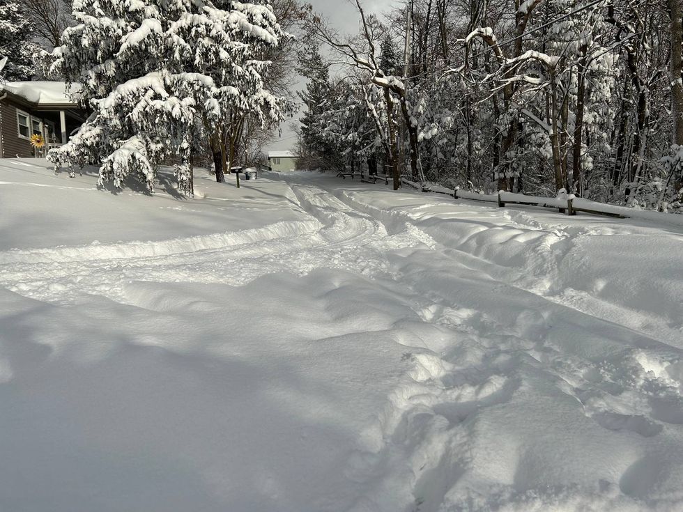 It was difficult to tell where the road is in Michigan City, Ind., on Saturday, after nearly 3 feet of snow fell in the area.