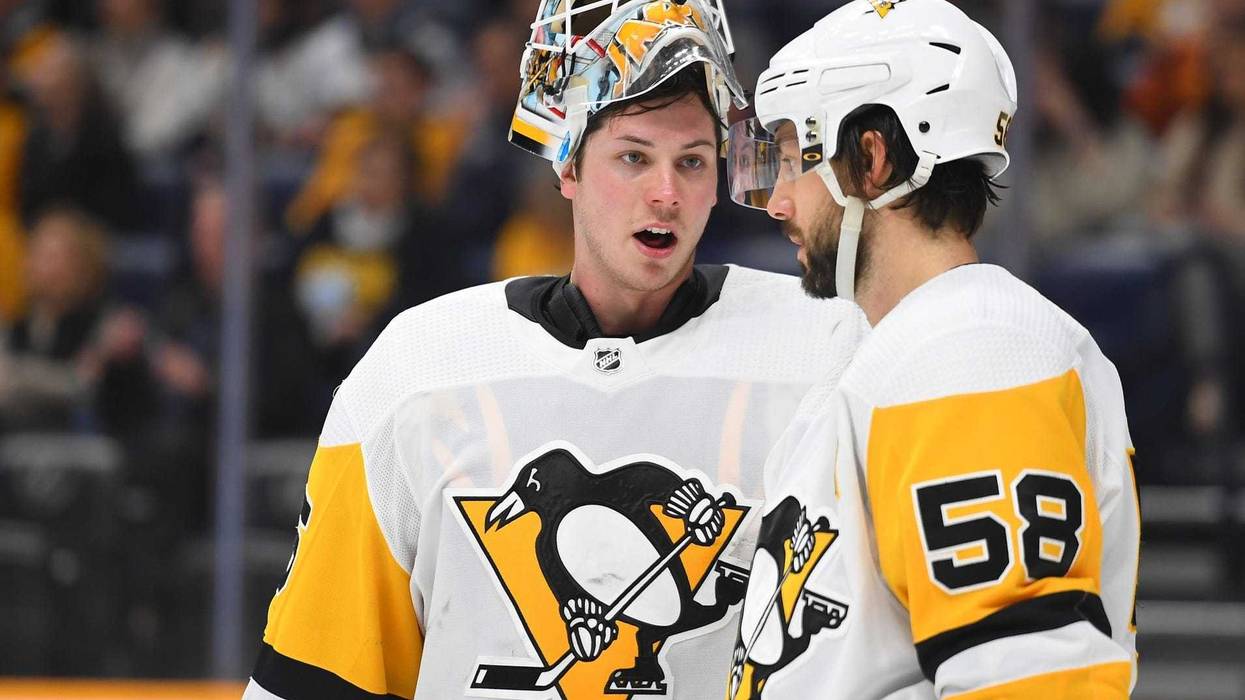 ittsburgh Penguins goaltender Tristan Jarry (35) talks with Pittsburgh Penguins defenseman Kris Letang