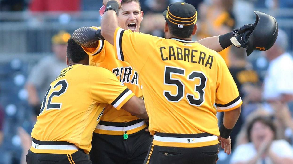 ittsburgh Pirates catcher Elias Diaz (32) and shortstop Kevin Newman (middle) and right fielder Melky Cabrera