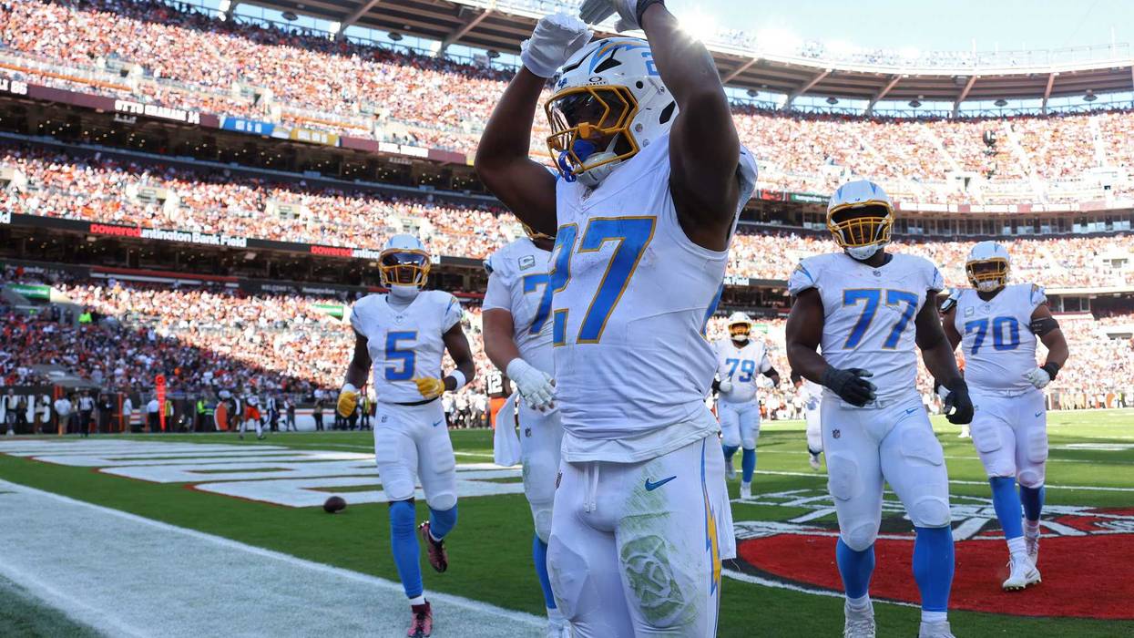 J.K. Dobbins #27 of the Los Angeles Chargers celebrates after scoring a rushing touchdown in the second quarter of a game against the Cleveland Browns at Huntington Bank Field on November 03, 2024 in Cleveland, Ohio.