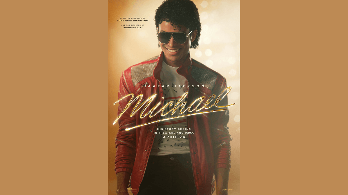 Jaafar Jackson as Michael Jackson smiling in an iconic red jacket & aviator sunglasses. Michael movie poster.
