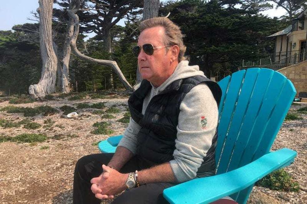 Jack Grandcolas, who lost his pregnant wife on United Flight 93, sits and looks out at the ocean near his home in Pebble Beach, Calif., Aug. 18, 2021. Twenty years later, Grandcolas still remembers waking up at 7:03 that morning. He looked at the clock, then out the window where an image in the sky caught his eye — a fleeting vision that looked like an angel ascending. He didn