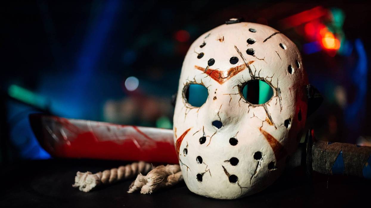 Jack's mask with a bloody sword on Halloween holiday