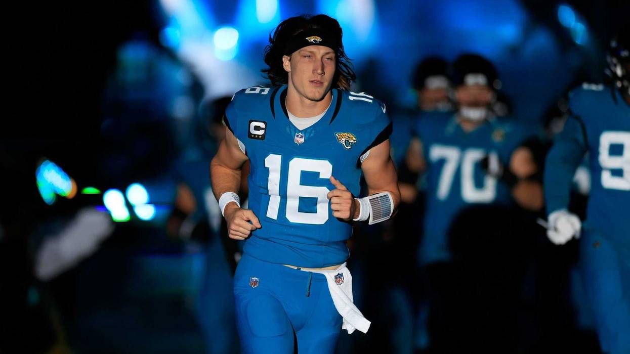 Jacksonville Jaguars quarterback Trevor Lawrence (16) runs onto the field before a game this season.