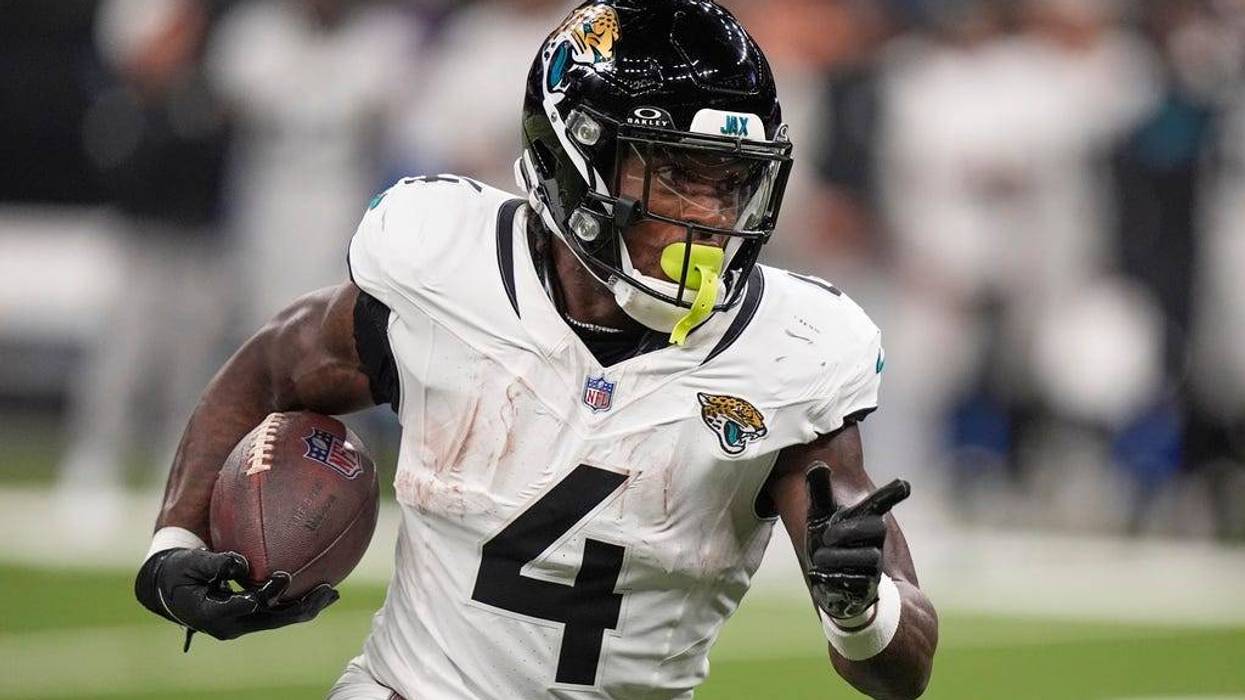 Jacksonville Jaguars running back Tank Bigsby (4) runs against the New Orleans Saints in the first half of an NFL preseason football game in New Orleans, Sunday, Aug. 17, 2025.