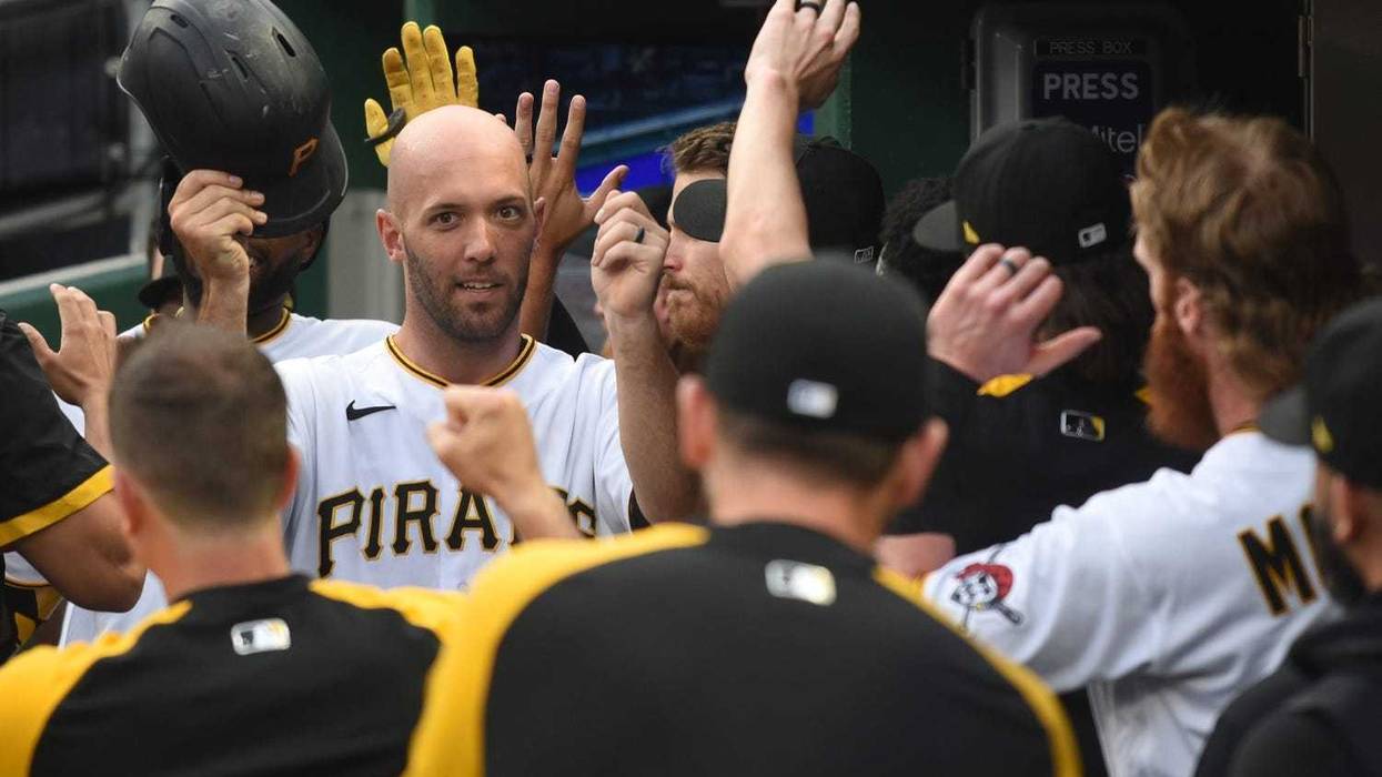 Jacob Stallings celebrating in dugout