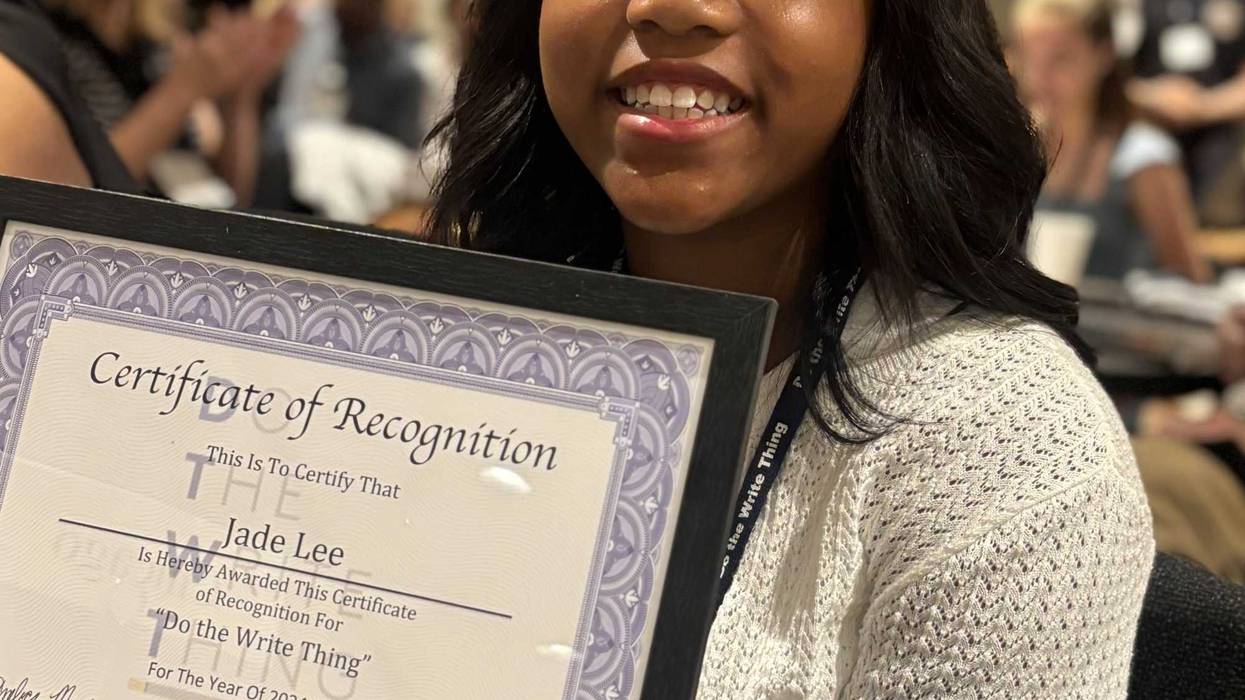 Jade Lee with her Certificate of Recognition after winning the "Do the Write Thing" writing contest. Her essay was chosen among over 800 essays submitted by CPS students to represent Chicago in the national campaign.