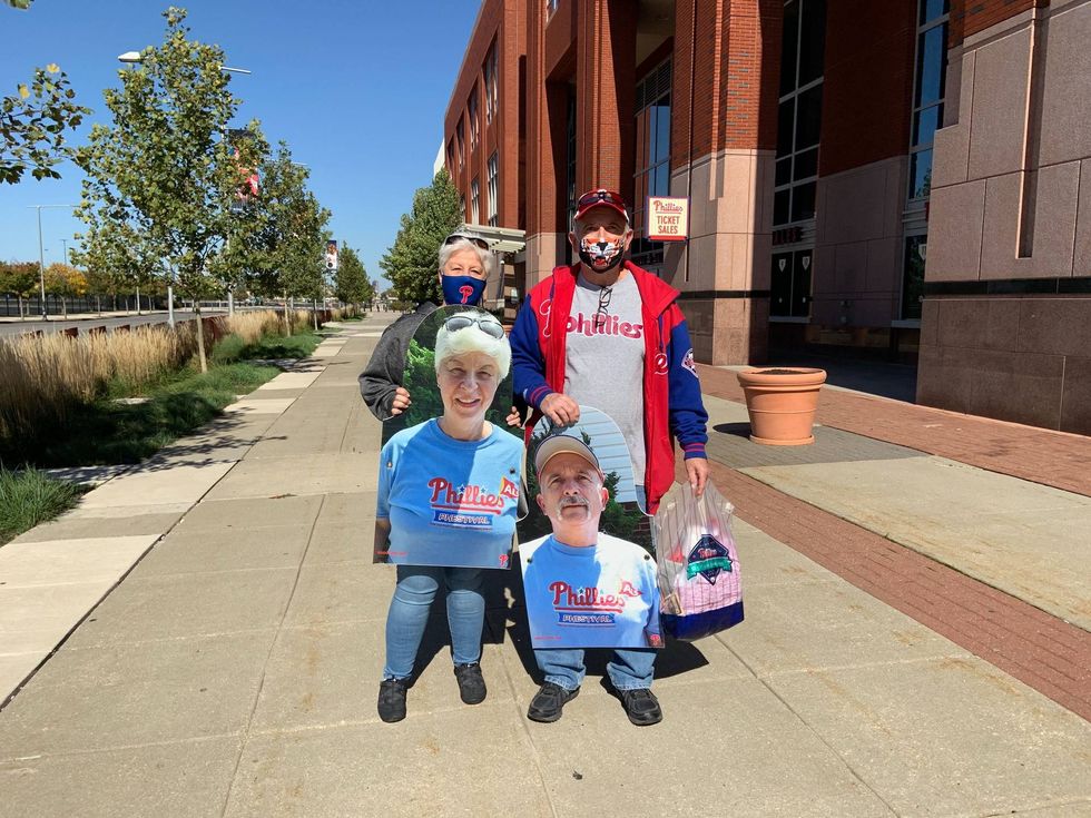 Jae Dimarcantonio of Warminster and her husband Frank hold their cutouts.