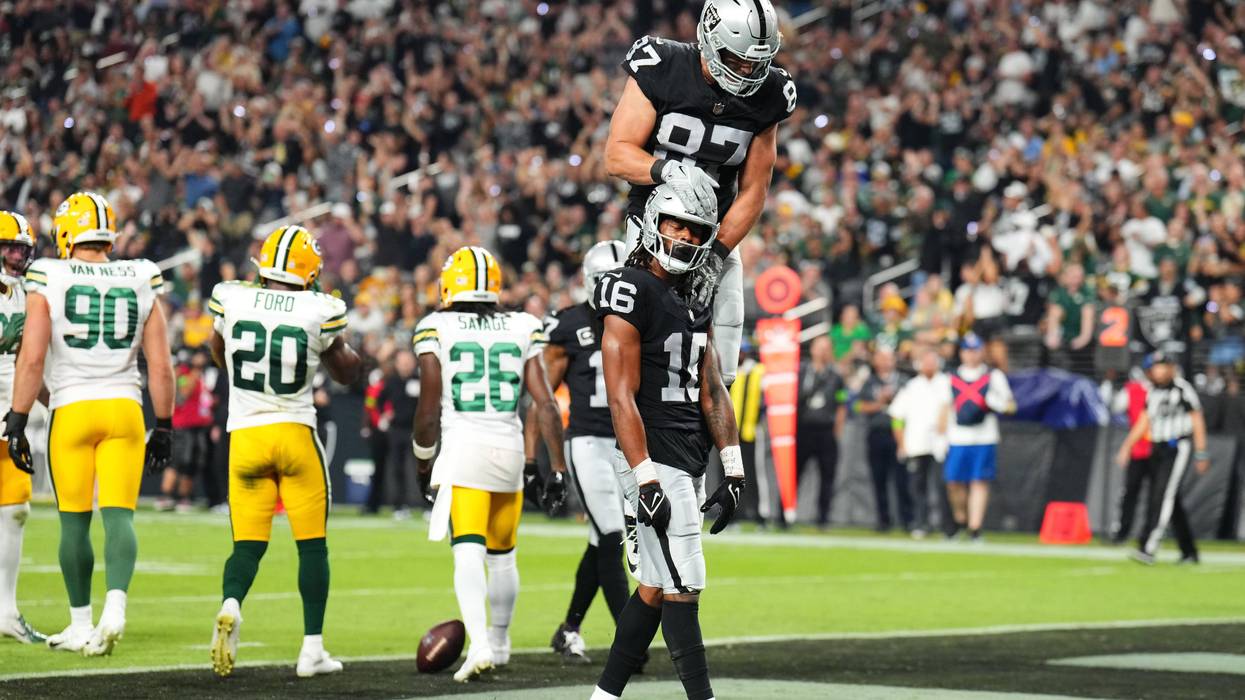 Jakobi Meyers #16 of the Las Vegas Raiders celebrates his touchdown catch with Michael Mayer #87 during the second quarter against the Green Bay Packers at Allegiant Stadium