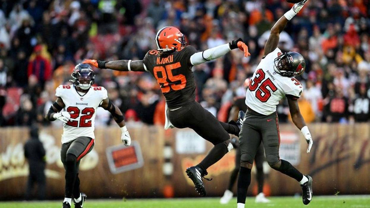 Jamel Dean knocking a pass away