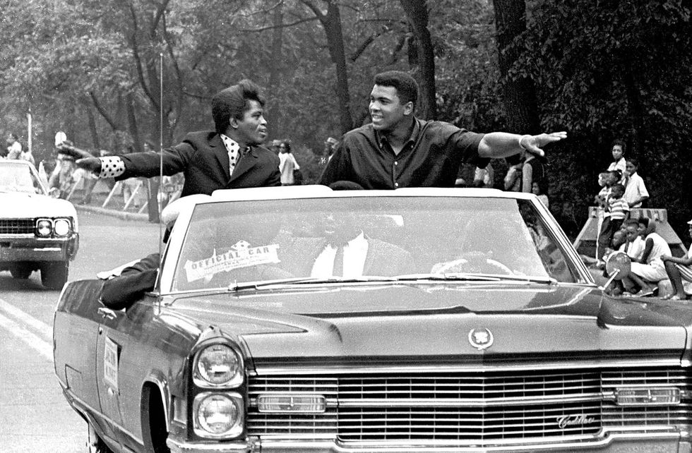 James Brown and Muhammad Ali smile and greet parade goers