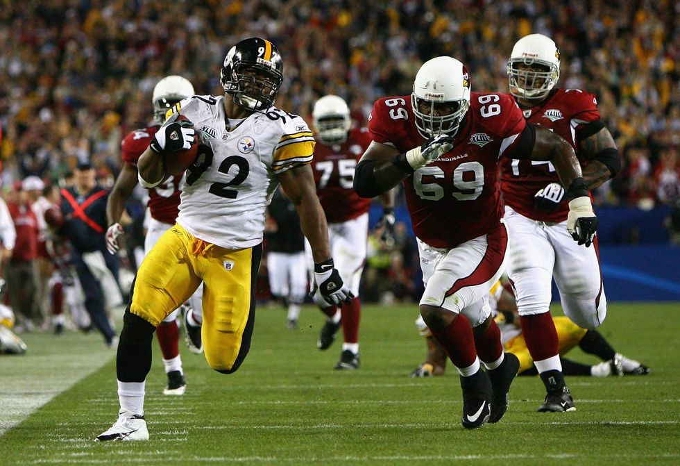 James Harrison returning a Kurt Warner interception for a pick-six during Super Bowl XLVIII