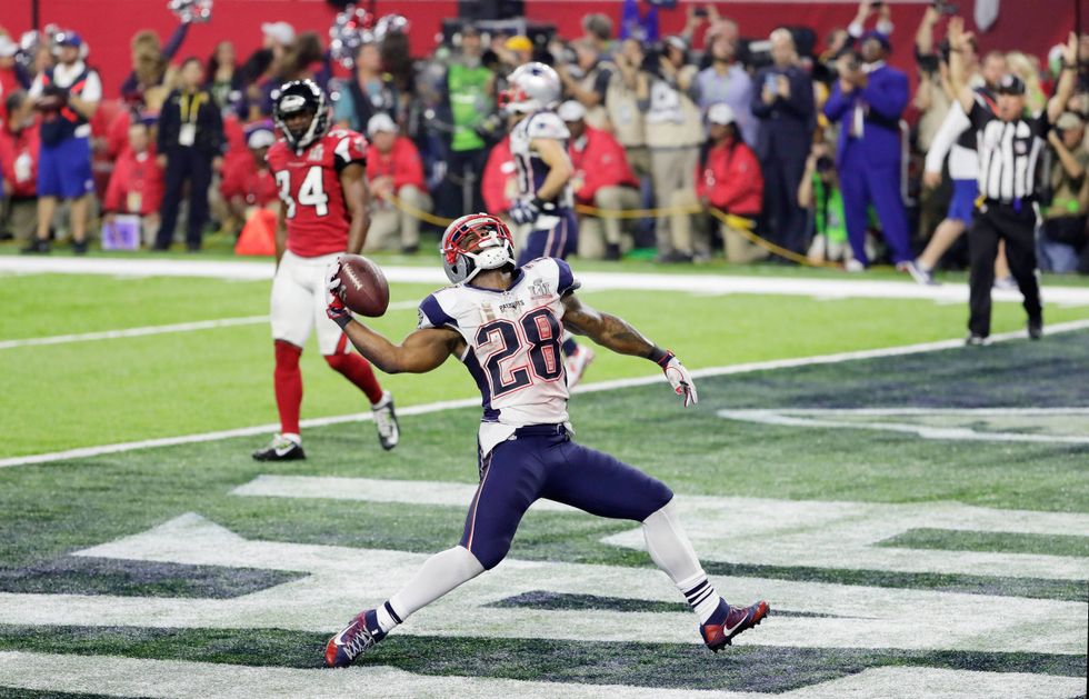 James White spikes the ball after scoring in Super Bowl LI