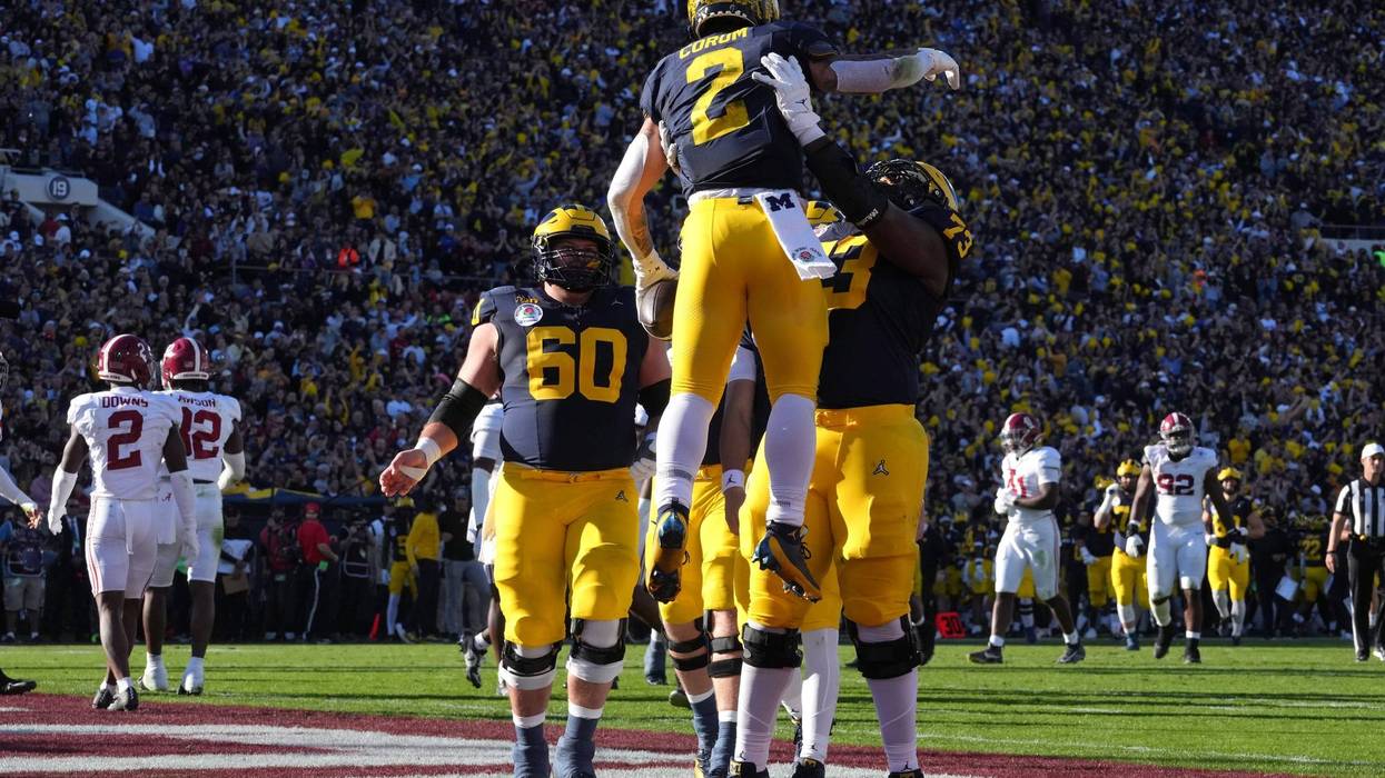 Jan 1, 2024; Pasadena, CA, USA; Michigan Wolverines running back Blake Corum (2) is congratulated by offensive lineman LaDarius Henderson (73) after scoring a touchdown against the Alabama Crimson Tide during the first half in the 2024 Rose Bowl college football playoff semifinal game at Rose Bowl.