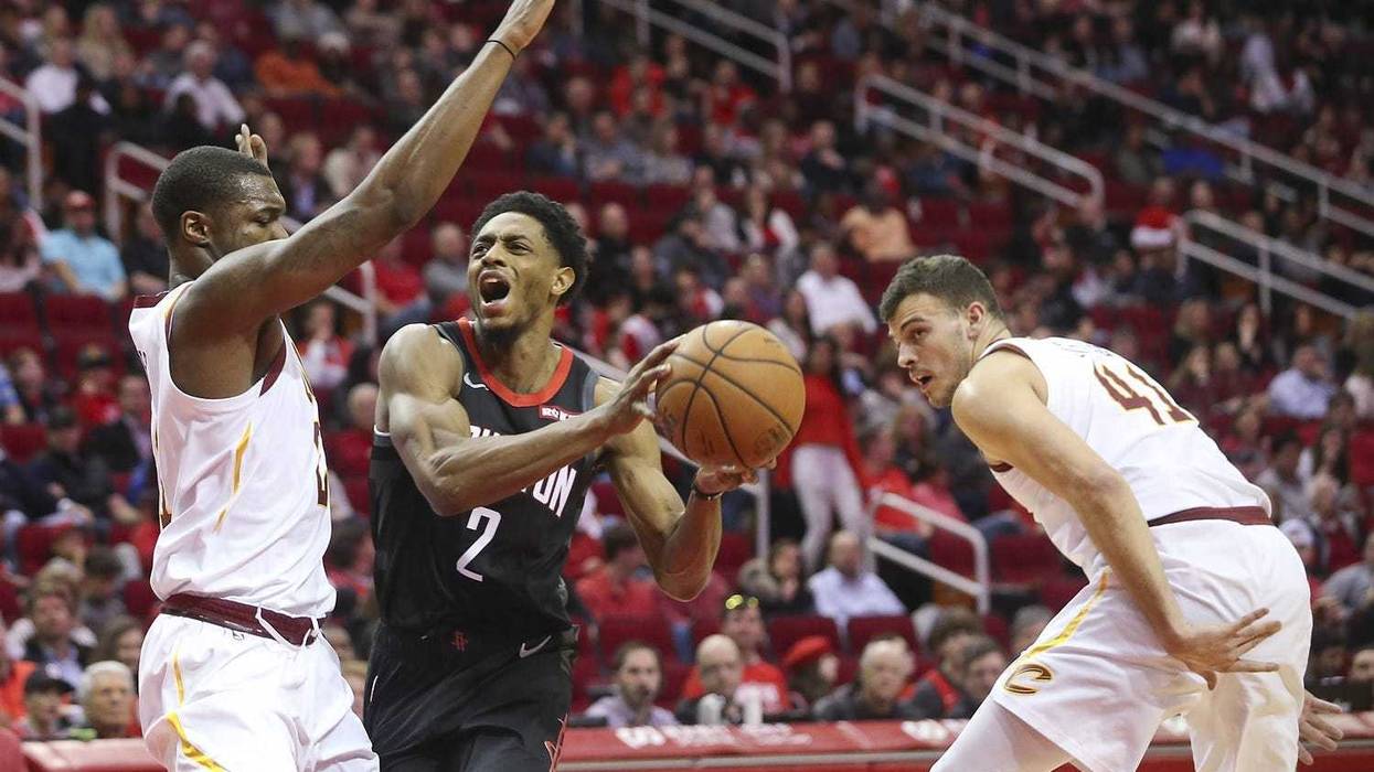 Jan 11, 2019; Houston, TX, USA; Houston Rockets guard Brandon Knight (2) spilts the defense of Cleveland Cavaliers guard Collin Sexton (2) and center Ante Zizic (41) in the second half at Toyota Center. Mandatory Credit: Thomas B. Shea-USA TODAY Sports