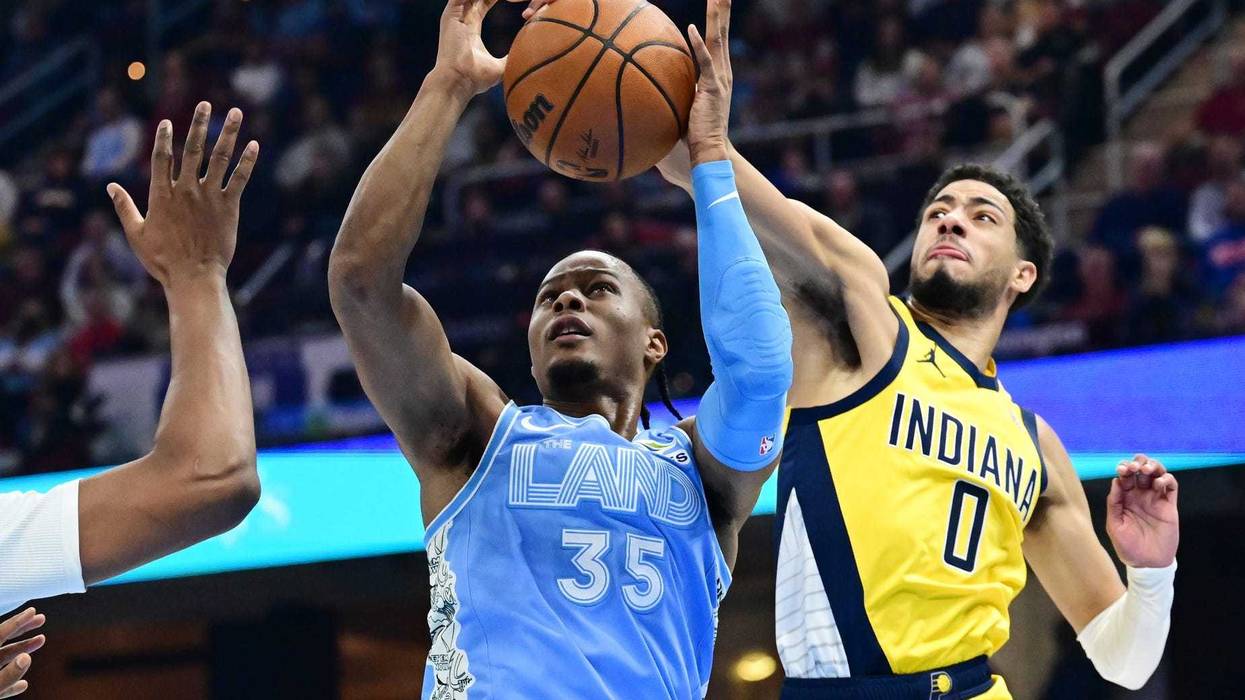 Jan 12, 2025; Cleveland, Ohio, USA; Indiana Pacers guard Tyrese Haliburton (0) blocks the shot of Cleveland Cavaliers forward Isaac Okoro (35) during the first half at Rocket Mortgage FieldHouse.