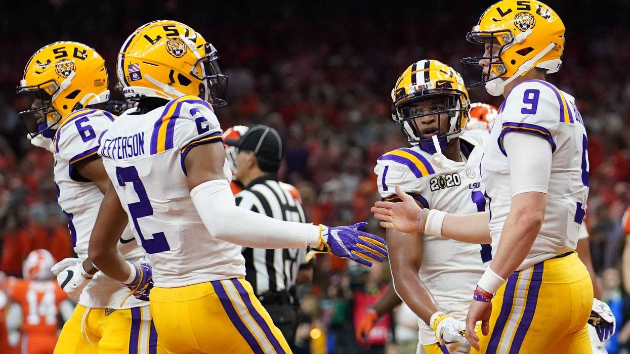 Jan 13, 2020; New Orleans, Louisiana, USA; LSU Tigers quarterback Joe Burrow (9) celebrates with wide receiver Justin Jefferson (2) after scoring a touchdown against the Clemson Tigers second quarter in the College Football Playoff national championship g