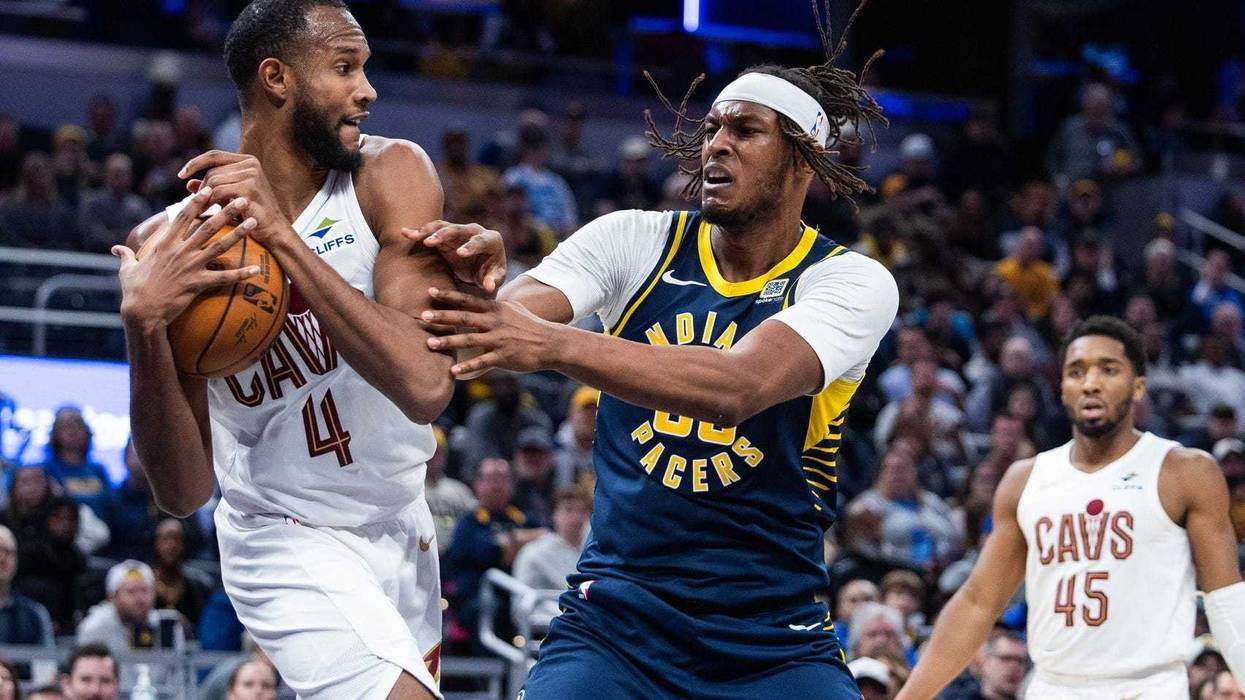 Jan 14, 2025; Indianapolis, Indiana, USA; Cleveland Cavaliers forward Evan Mobley (4) and Indiana Pacers center Myles Turner (33) fight for a rebound in the second half at Gainbridge Fieldhouse.