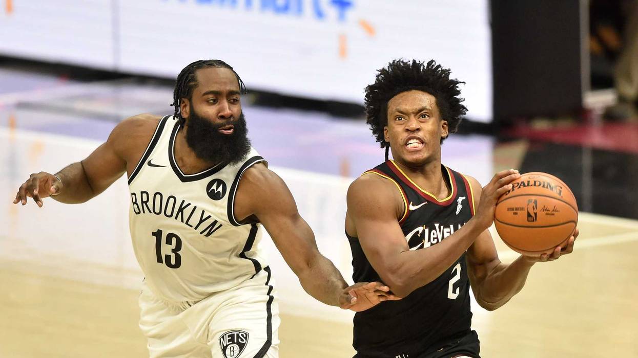 Jan 20, 2021; Cleveland, Ohio, USA; Cleveland Cavaliers guard Collin Sexton (2) drives against Brooklyn Nets guard James Harden (13) in the second overtime at Rocket Mortgage FieldHouse.